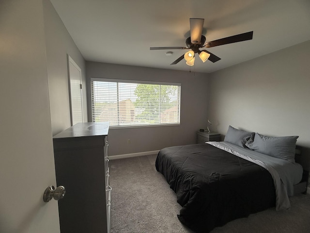 bedroom featuring a ceiling fan, carpet floors, and baseboards
