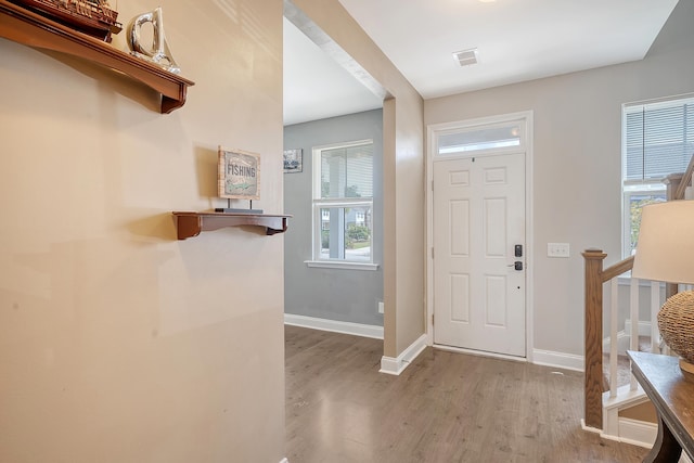 entrance foyer with light hardwood / wood-style floors