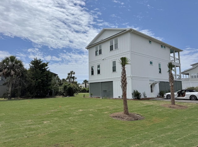 305 Matilda St, Edisto Beach, SC 29438 - view of side of property featuring a lawn and board and batten siding