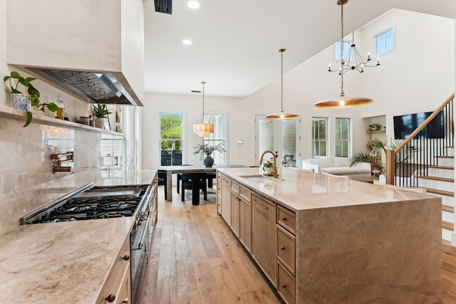 1474 Blue Cascade Dr, Mount Pleasant, SC 29464 - kitchen featuring wall chimney range hood, a sink, a chandelier, light wood-style flooring, and open shelves