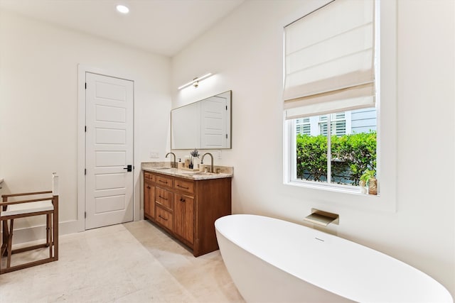 1474 Blue Cascade Dr, Mount Pleasant, SC 29464 - bathroom featuring a freestanding bath, double vanity, and recessed lighting