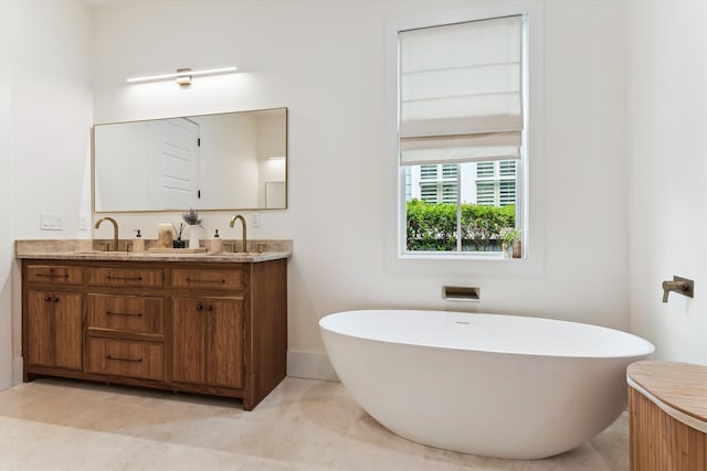 1474 Blue Cascade Dr, Mount Pleasant, SC 29464 - bathroom featuring double vanity, a freestanding bath, and baseboards