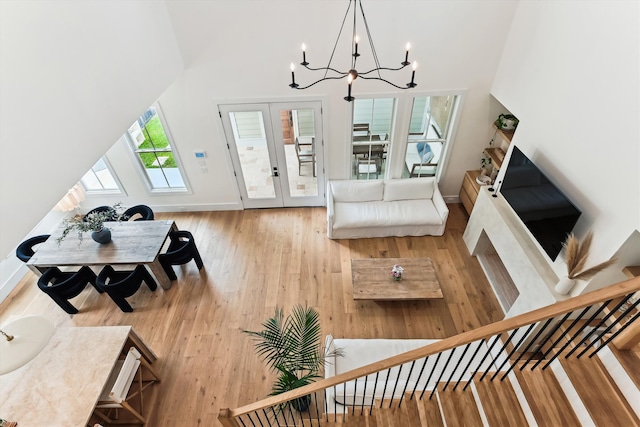 1474 Blue Cascade Dr, Mount Pleasant, SC 29464 - living area featuring hardwood / wood-style floors, a chandelier, french doors, baseboards, and stairs