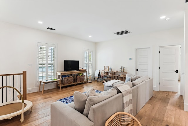 1474 Blue Cascade Dr, Mount Pleasant, SC 29464 - living room with light wood finished floors, recessed lighting, and baseboards