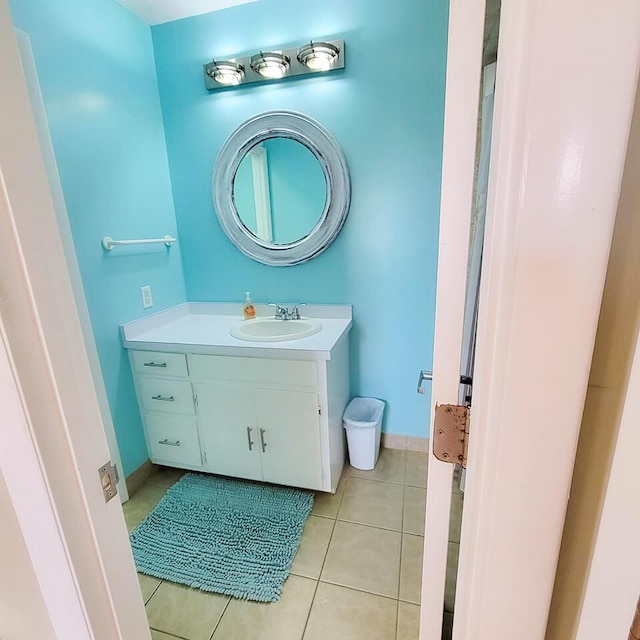 bathroom featuring tile patterned flooring and vanity