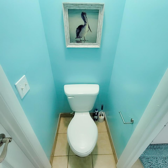 bathroom with tile patterned flooring and toilet