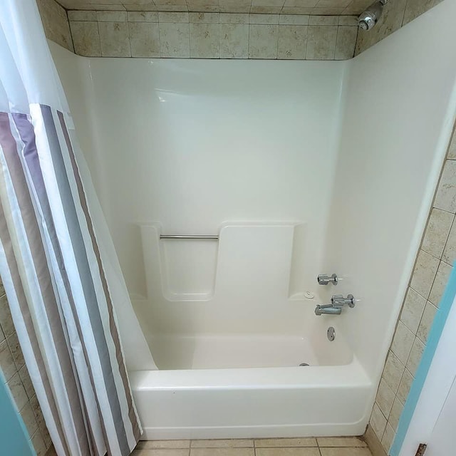 bathroom featuring shower / tub combo with curtain and tile patterned floors