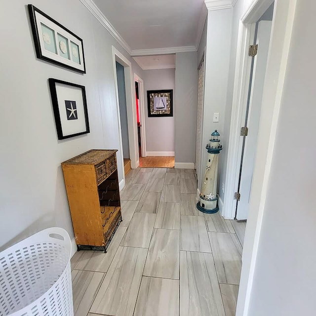 hallway featuring crown molding