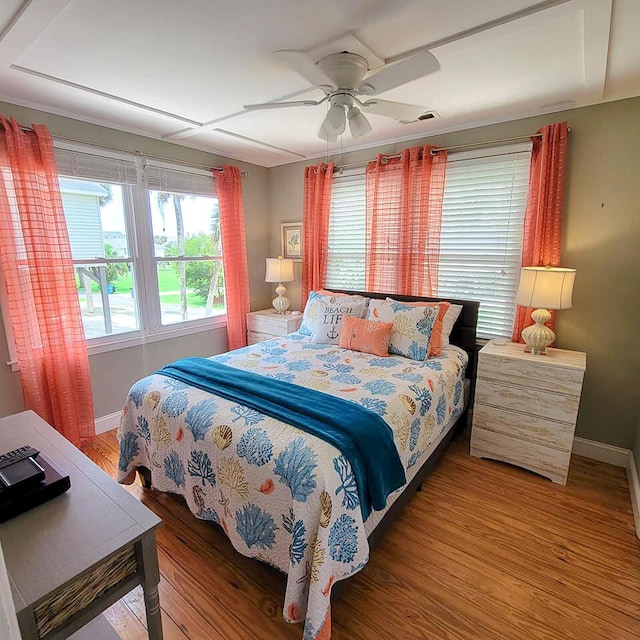 bedroom featuring wood-type flooring and ceiling fan