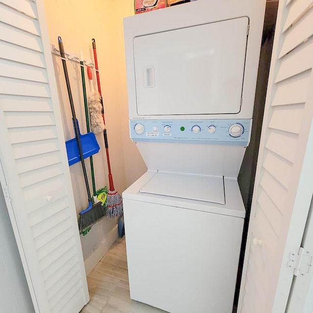 laundry area featuring stacked washer and dryer