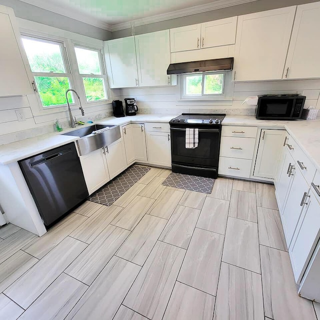 kitchen featuring sink, exhaust hood, white cabinets, and black appliances