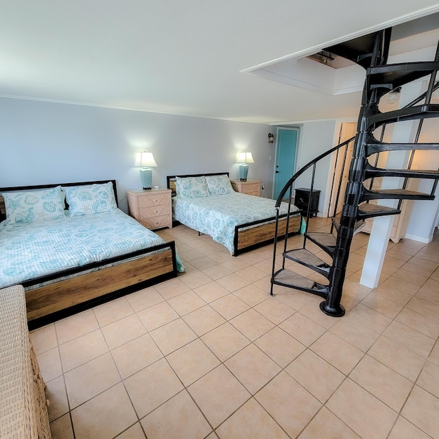 bedroom with light tile patterned floors