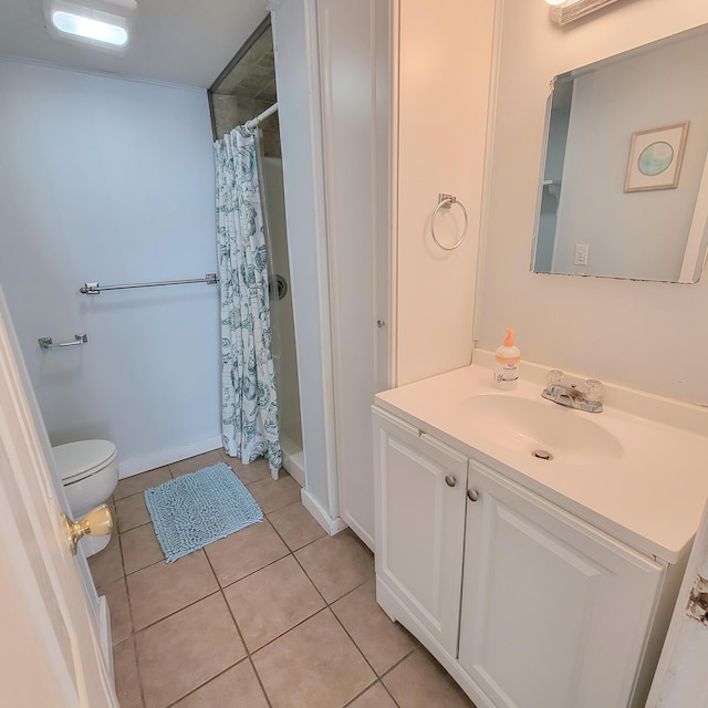 bathroom featuring tile patterned flooring, vanity, toilet, and a shower with shower curtain