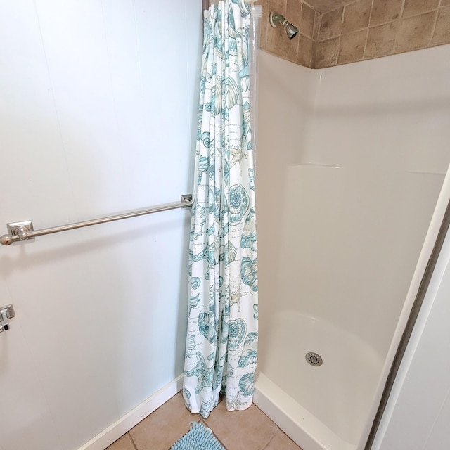 bathroom featuring tile patterned flooring and a shower with curtain