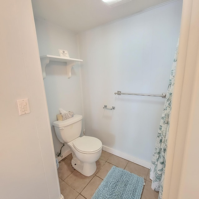 bathroom with tile patterned floors and toilet