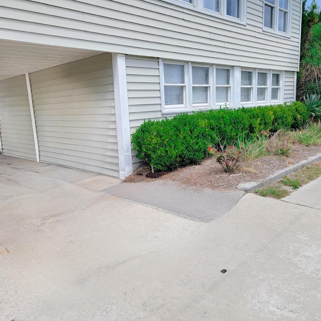 exterior space with a carport