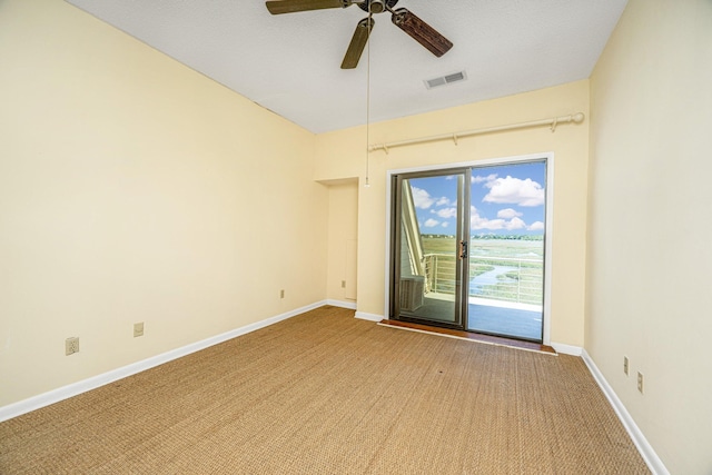 carpeted empty room featuring ceiling fan