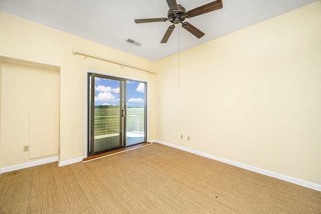 unfurnished room with carpet and ceiling fan