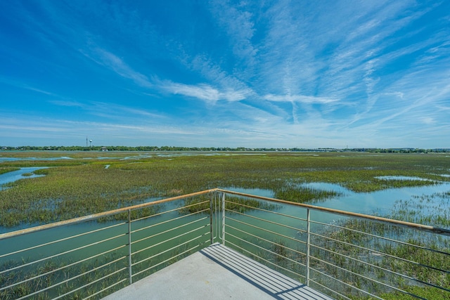 balcony featuring a water view