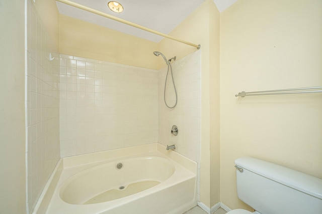 bathroom featuring toilet and shower / tub combination