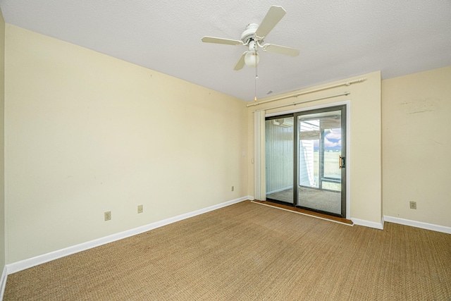 unfurnished room with carpet flooring, ceiling fan, and a textured ceiling