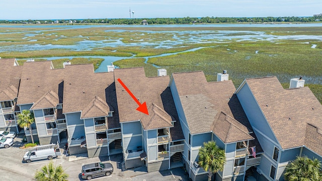 birds eye view of property featuring a water view