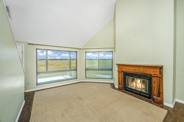 unfurnished living room with vaulted ceiling