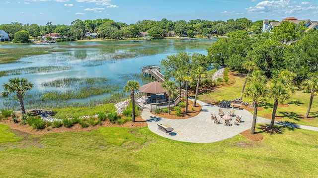 birds eye view of property with a water view