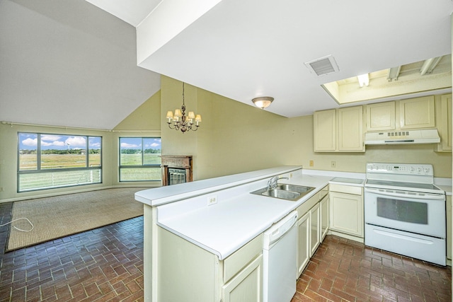 kitchen featuring sink, a notable chandelier, kitchen peninsula, decorative light fixtures, and white appliances