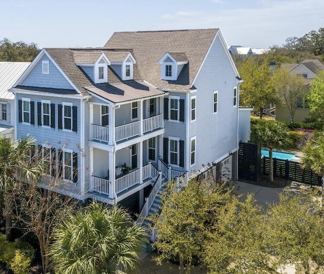 exterior space featuring an attached garage and a balcony