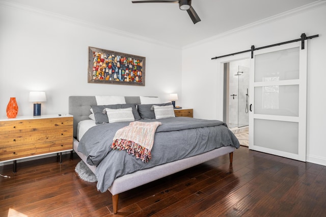bedroom with a barn door, wood-type flooring, a ceiling fan, and ornamental molding