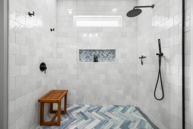 full bathroom featuring tiled shower