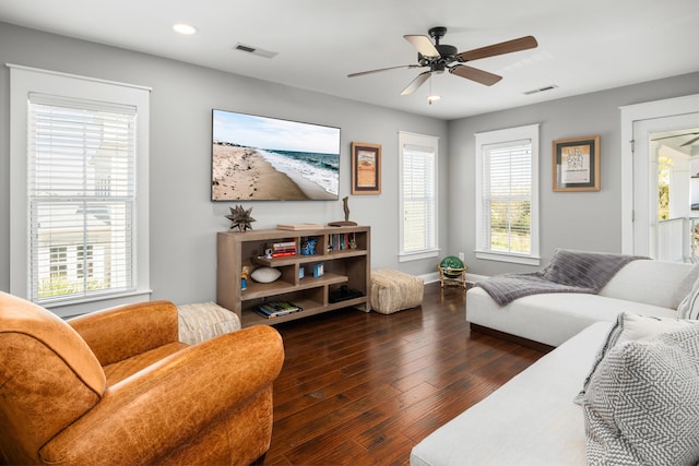 living room with recessed lighting, visible vents, and a wealth of natural light