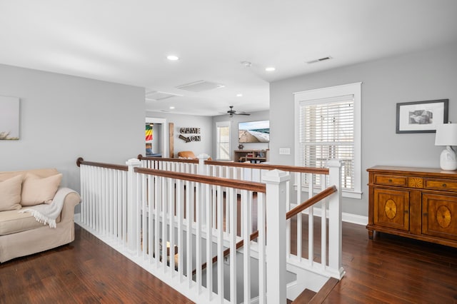 corridor featuring baseboards, visible vents, recessed lighting, an upstairs landing, and hardwood / wood-style flooring