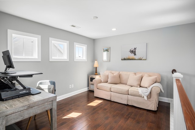 living area with baseboards, visible vents, recessed lighting, and dark wood-type flooring