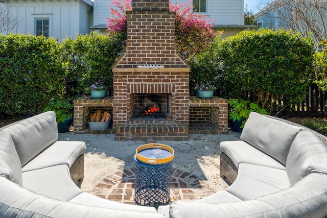 view of patio featuring an outdoor living space with a fireplace