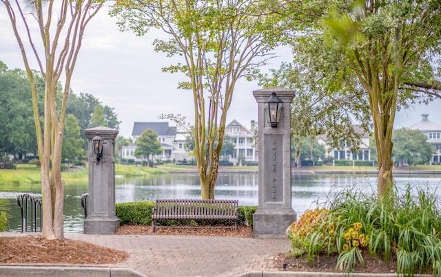 surrounding community featuring a water view
