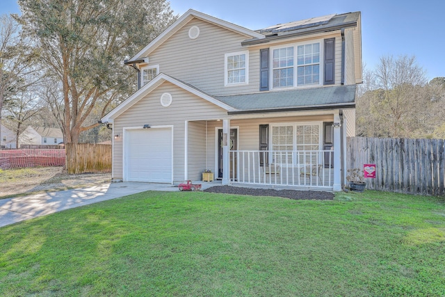 traditional-style home featuring a porch, a front yard, driveway, and fence