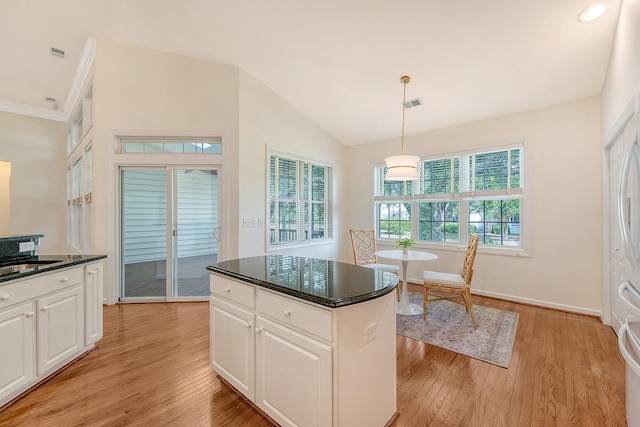 kitchen featuring white cabinetry, visible vents, and light wood-style floors