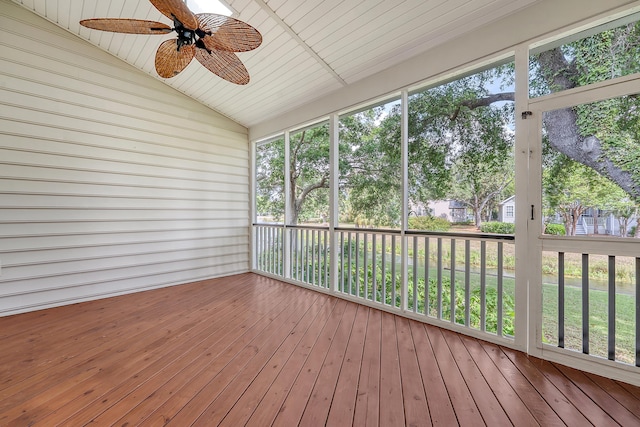 unfurnished sunroom with a ceiling fan