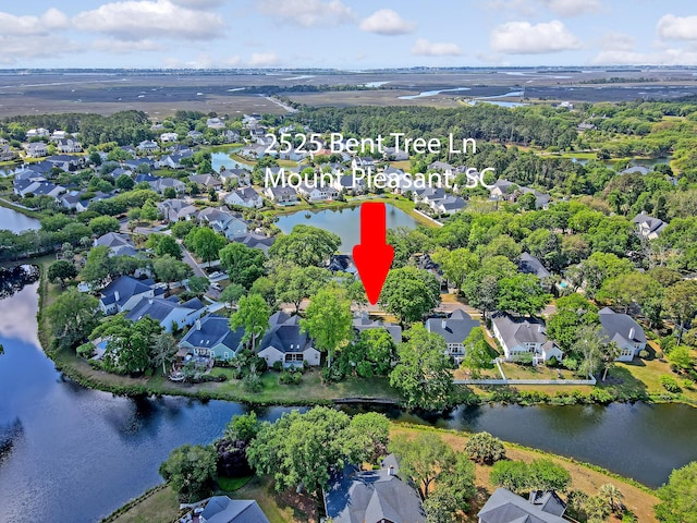 bird's eye view with a water view and a residential view