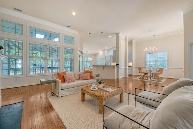 living area featuring an inviting chandelier and plenty of natural light