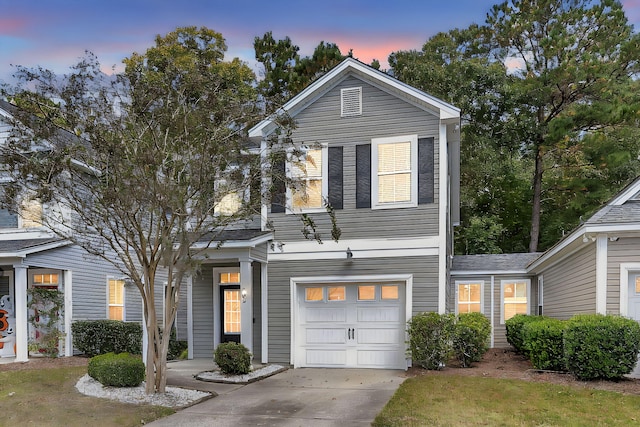 view of front of house with driveway and a garage