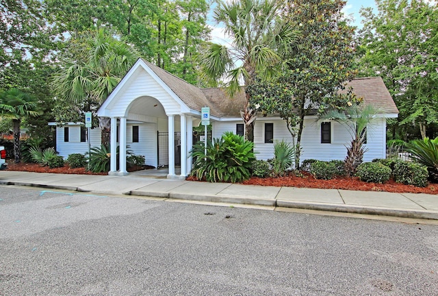 view of front of house featuring roof with shingles