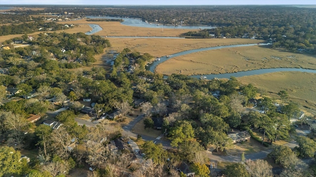 aerial view with a water view and a view of trees