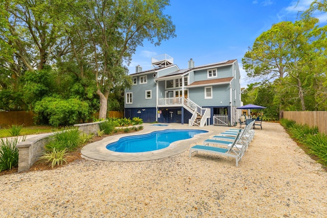 view of swimming pool featuring a patio area