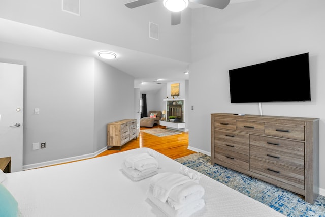 bedroom with light wood-type flooring and ceiling fan