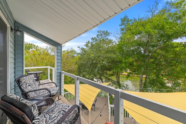 balcony featuring a water view