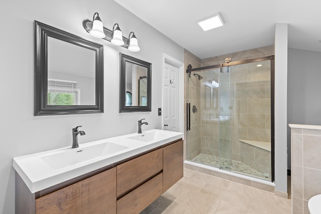 bathroom with vanity, walk in shower, and tile patterned flooring