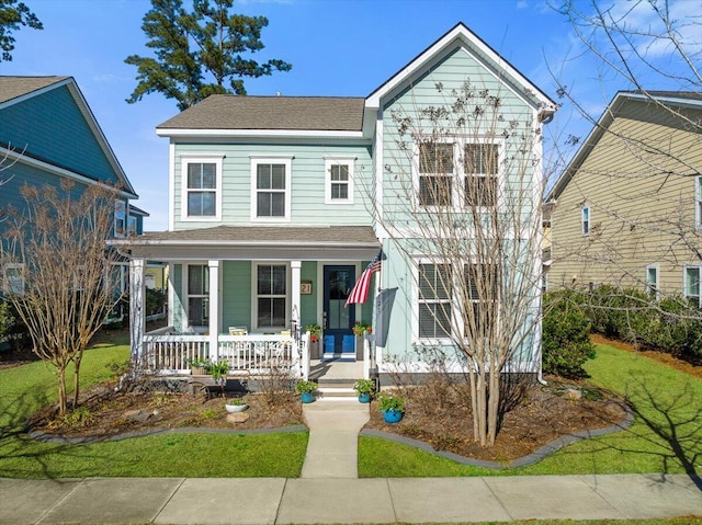 view of front of house with a front lawn and covered porch